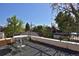 Rooftop deck with patio furniture and views of the surrounding trees and houses at 747 N Downing St, Denver, CO 80218
