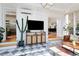 Bright sunroom with black and white tile floors, modern decor, and plenty of natural light at 747 N Downing St, Denver, CO 80218