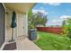 A private backyard with a green lawn and a wooden privacy fence at 7474 E Arkansas Ave # 13-02, Denver, CO 80231
