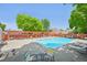 Exterior of the community pool, complete with lounge chairs, trellises and nearby common areas for relaxing at 7474 E Arkansas Ave # 13-02, Denver, CO 80231