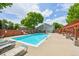 Community pool featuring lounge chairs and seating areas, perfect for relaxing and enjoying the summer at 7474 E Arkansas Ave # 13-02, Denver, CO 80231