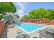 Exterior of the bright community pool, complete with lounge chairs, trellises and nearby common areas at 7474 E Arkansas Ave # 13-02, Denver, CO 80231