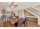 Dining area with hardwood floors is situated next to the stairs and kitchen at 7474 E Arkansas Ave # 13-02, Denver, CO 80231