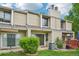 Townhome exterior with inviting front lawn and patio spaces at 7474 E Arkansas Ave # 13-02, Denver, CO 80231
