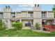 Charming two-story townhome with well-maintained lawn and patio area at 7474 E Arkansas Ave # 13-02, Denver, CO 80231