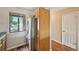 This kitchen features wooden cabinets, stainless steel appliances, and wood flooring at 7474 E Arkansas Ave # 13-02, Denver, CO 80231