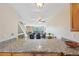 This kitchen features granite countertops and a view to the living room with a fireplace at 7474 E Arkansas Ave # 13-02, Denver, CO 80231