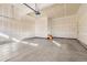 Spacious garage with concrete flooring and room for multiple cars or a workshop at 23527 E 5Th Pl, Aurora, CO 80018