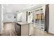 Modern kitchen island with stainless dishwasher and sink and sliding door access to patio at 23527 E 5Th Pl, Aurora, CO 80018