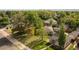 Aerial view of a neighborhood with large, mature trees, and well manicured lawns at 4567 Grove St, Denver, CO 80211
