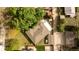 Aerial view of a charming home with a well-maintained lawn, mature trees, and a private backyard at 4567 Grove St, Denver, CO 80211