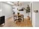 Charming dining room with wood table, stylish chandelier, and a view of the kitchen at 4567 Grove St, Denver, CO 80211