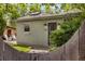 Charming home exterior featuring a cozy porch and well-maintained yard, perfect for relaxing outdoors at 4567 Grove St, Denver, CO 80211