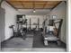 Spacious garage converted into a home gym, featuring modern exercise equipment for a convenient fitness routine at 4567 Grove St, Denver, CO 80211