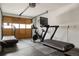 Well-equipped home gym featuring a treadmill and stationary bicycle, perfect for fitness enthusiasts at 4567 Grove St, Denver, CO 80211