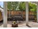 Comfortable patio with dining set, barrel sauna, and decorative flower boxes at 4567 Grove St, Denver, CO 80211