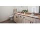 Bathroom boasting a double vanity with modern cabinets, sink, and hardware at 919 Russell St, Golden, CO 80401
