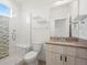 Modern bathroom with shower, toilet, vanity and cabinets at 919 Russell St, Golden, CO 80401