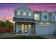 Charming two-story home with a welcoming porch and attached garage at 919 Russell St, Golden, CO 80401