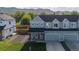 A view of the home and surrounding community with mountain views at 919 Russell St, Golden, CO 80401
