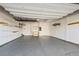 Spacious garage with epoxy flooring, shelving, and ample storage space at 919 Russell St, Golden, CO 80401