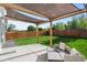 Backyard patio with shade structure and outdoor furniture at 919 Russell St, Golden, CO 80401