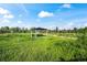 A picnic pavilion with a black roof and white pillars in a park with tall grassy fields at 919 Russell St, Golden, CO 80401