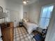 Bright bedroom featuring a twin bed, natural light and a neutral color palette at 69 W Cedar Ave, Denver, CO 80223