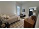 Bright bedroom with a single bed and a wooden dresser with a view of the entrance at 69 W Cedar Ave, Denver, CO 80223