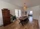 Dining area featuring hardwood floors, a chandelier and natural light at 69 W Cedar Ave, Denver, CO 80223