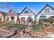 Charming home featuring vibrant trim, a brick foundation, and a well-manicured front yard at 69 W Cedar Ave, Denver, CO 80223