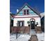 Charming home featuring a unique colorful roof, brick accents, and inviting front entrance. The property is well-maintained and welcoming at 69 W Cedar Ave, Denver, CO 80223