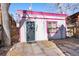 View of pink-trimmed garage at 69 W Cedar Ave, Denver, CO 80223