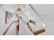 Bright hallway featuring white walls, hardwood floors, multiple windows, and staircase at 69 W Cedar Ave, Denver, CO 80223