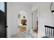 Hallway with marble floors leads to a living room with a fireplace at 69 W Cedar Ave, Denver, CO 80223