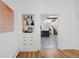 Hallway view featuring built-in shelving and an open floor plan leading to the staircase at 69 W Cedar Ave, Denver, CO 80223