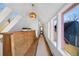 Bright hallway featuring skylights, natural wood accents, and modern lighting for an inviting space at 69 W Cedar Ave, Denver, CO 80223