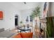 Cozy living room with a decorative fireplace and a view of the front yard at 69 W Cedar Ave, Denver, CO 80223