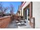 Relaxing patio with brick features, perfect for outdoor seating and enjoyment at 69 W Cedar Ave, Denver, CO 80223