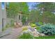 Charming backyard with inviting patio, landscaped with vibrant plants and mature trees, perfect for relaxation and outdoor enjoyment at 2398 Bitterroot Ln, Golden, CO 80401