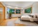 Cozy bedroom with hardwood floors, and bright windows with views, creating a relaxing and inviting atmosphere at 2398 Bitterroot Ln, Golden, CO 80401