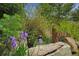 Charming curb appeal with stone accents and lush landscaping, displaying the house number '2398' at 2398 Bitterroot Ln, Golden, CO 80401