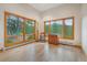Bright room with large windows offering stunning views of the surrounding trees and landscape at 2398 Bitterroot Ln, Golden, CO 80401