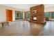 Inviting living room with a stone fireplace, wood floors, and natural light from the large windows at 2398 Bitterroot Ln, Golden, CO 80401