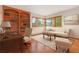 Elegant office featuring a built-in bookcase, hardwood floors, and bright windows, ideal for productivity and comfort at 2398 Bitterroot Ln, Golden, CO 80401