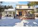 Two-story house with backyard deck, pergola, and snowy scenery at 8478 Prairie Clover Way, Parker, CO 80134