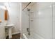 Bathroom with tub and pedestal sink at 8478 Prairie Clover Way, Parker, CO 80134