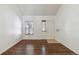 Simple entryway with wood-look floors and white walls at 8478 Prairie Clover Way, Parker, CO 80134