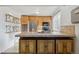 Bright kitchen features stainless steel appliances and light wood cabinets at 8478 Prairie Clover Way, Parker, CO 80134