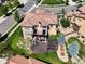Aerial view showcasing the property's beautiful backyard, deck, patio, and surrounding landscape at 2256 S Isabell Ct, Lakewood, CO 80228